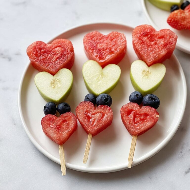 Heart-Shaped Fruit Skewers with Watermelon, Cantaloupe, Honeydew, and Berries Recipe